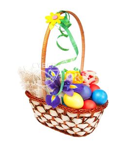 Happy Easter!. A basket of Easter eggs decorated with fresh spring flowers.
